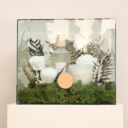 luxury home fragrance gift set featuring Culti Milano diffuser and candle with preserved roses in acrylic display.