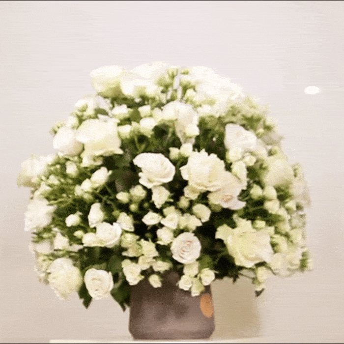 Luxurious Gardenia floral arrangement with premium roses in soft romantic tones, a timeless tribute to elegance and joy in Victorian style.
