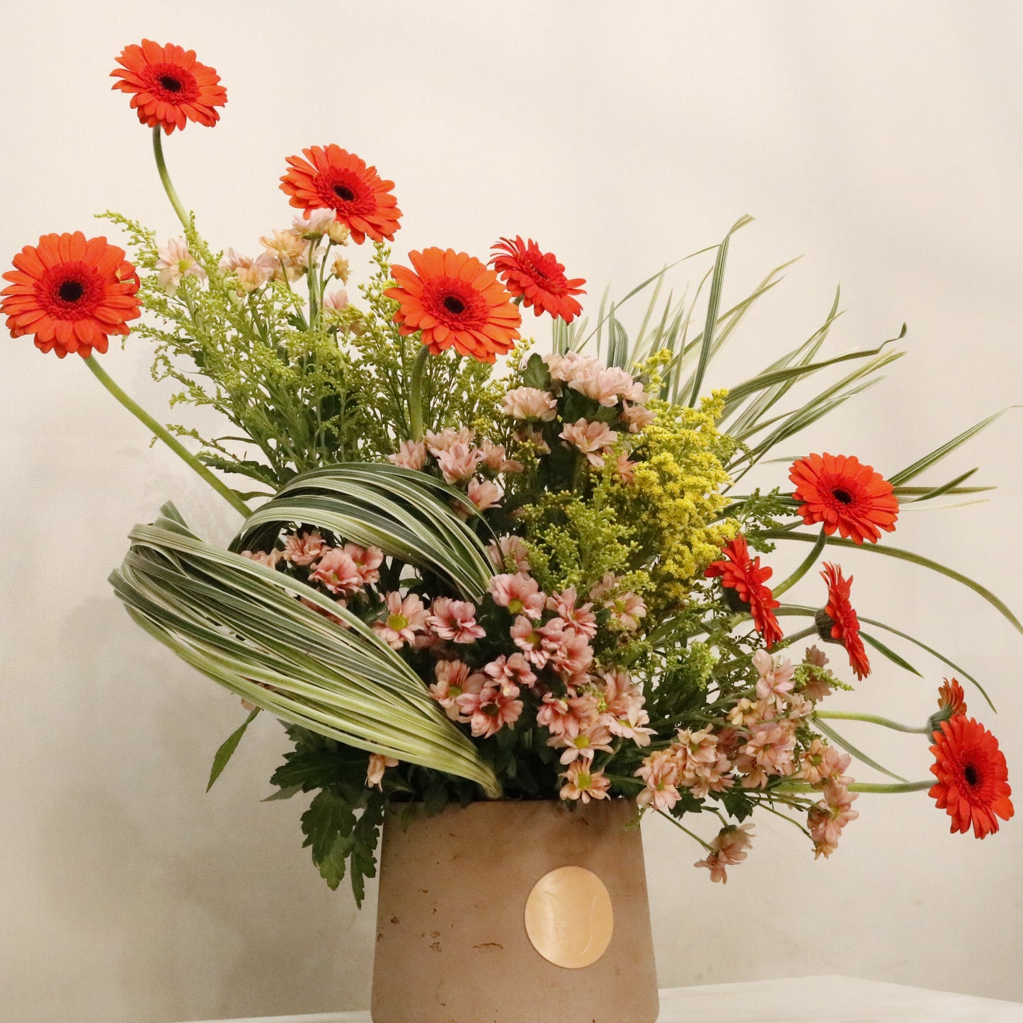 ORÉ luxury floral arrangement premium handcrafted golden toned blooms elegant statement gifting Kuwait Vitali Concept