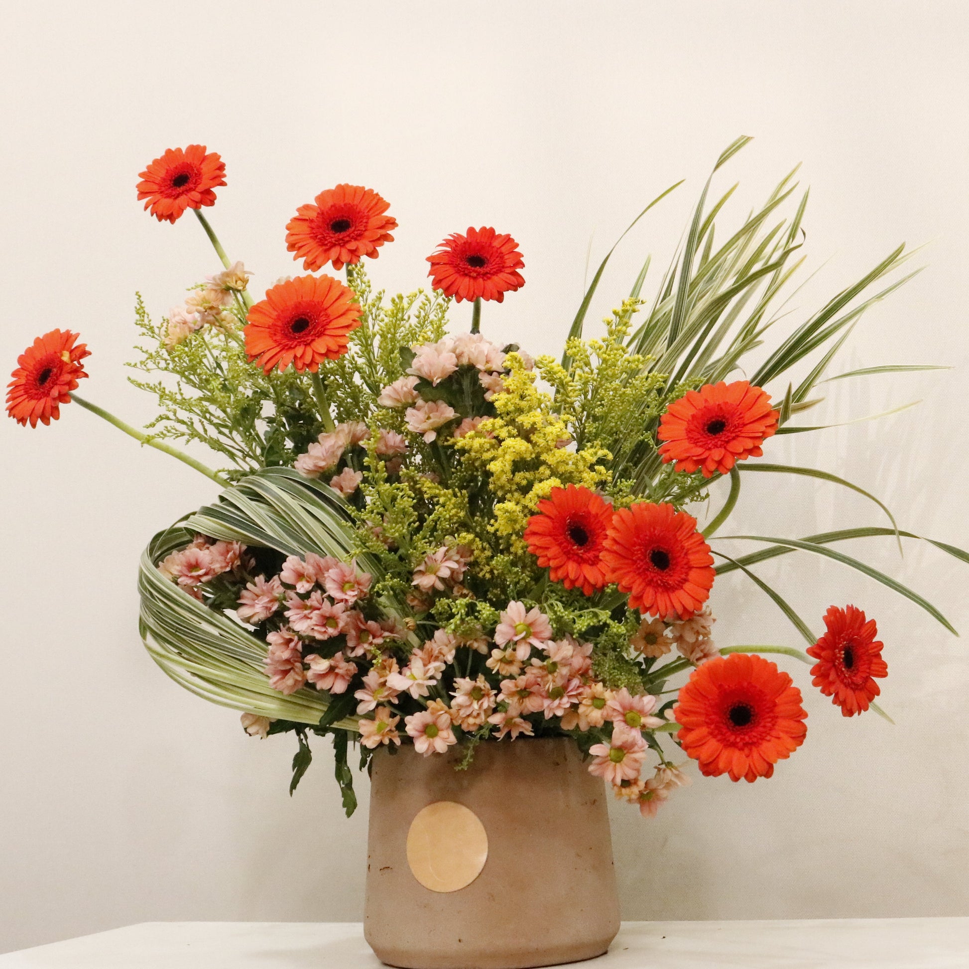 ORÉ luxury floral arrangement premium handcrafted golden toned blooms elegant statement gifting Kuwait Vitali Concept