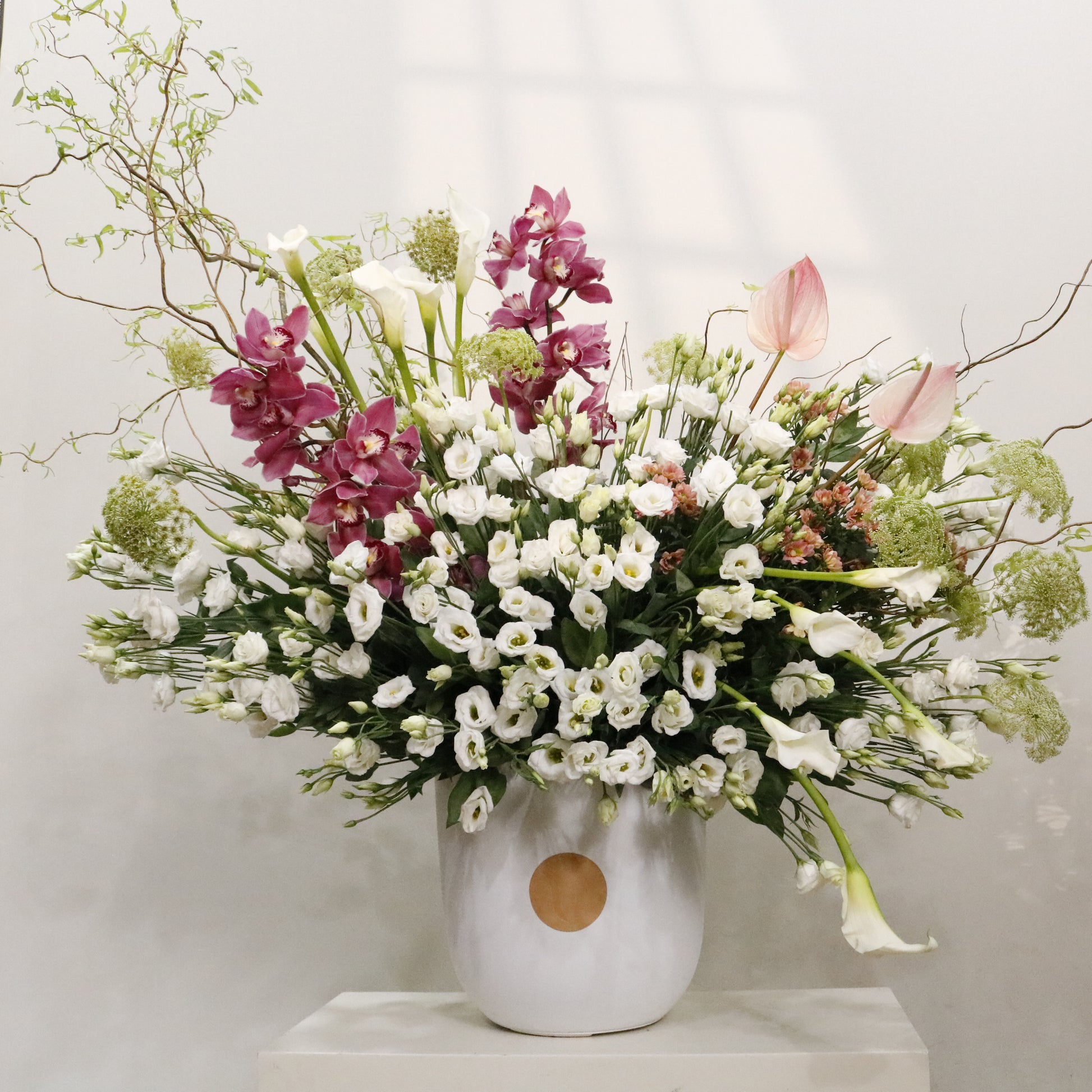 La Majesté luxury floral arrangement white lisianthus calla lilies cymbidium orchids blush anthuriums sculptural branches Kuwait Vitali Concept