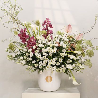 La Majesté luxury floral arrangement white lisianthus calla lilies cymbidium orchids blush anthuriums sculptural branches Kuwait Vitali Concept