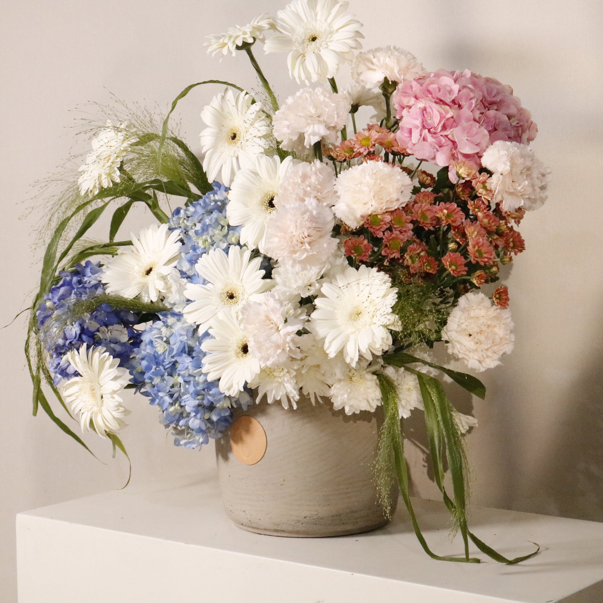 Celeste luxury floral arrangement blue hydrangeas white gerberas blush carnations pink hydrangeas Kuwait Vitali Concept