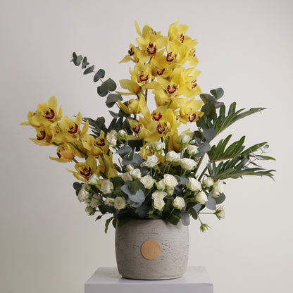 Royal Amber luxury floral arrangement yellow cymbidium orchids white roses luxury interiors Kuwait Vitali Concept