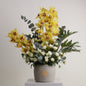 Royal Amber luxury floral arrangement yellow cymbidium orchids white roses luxury interiors Kuwait Vitali Concept