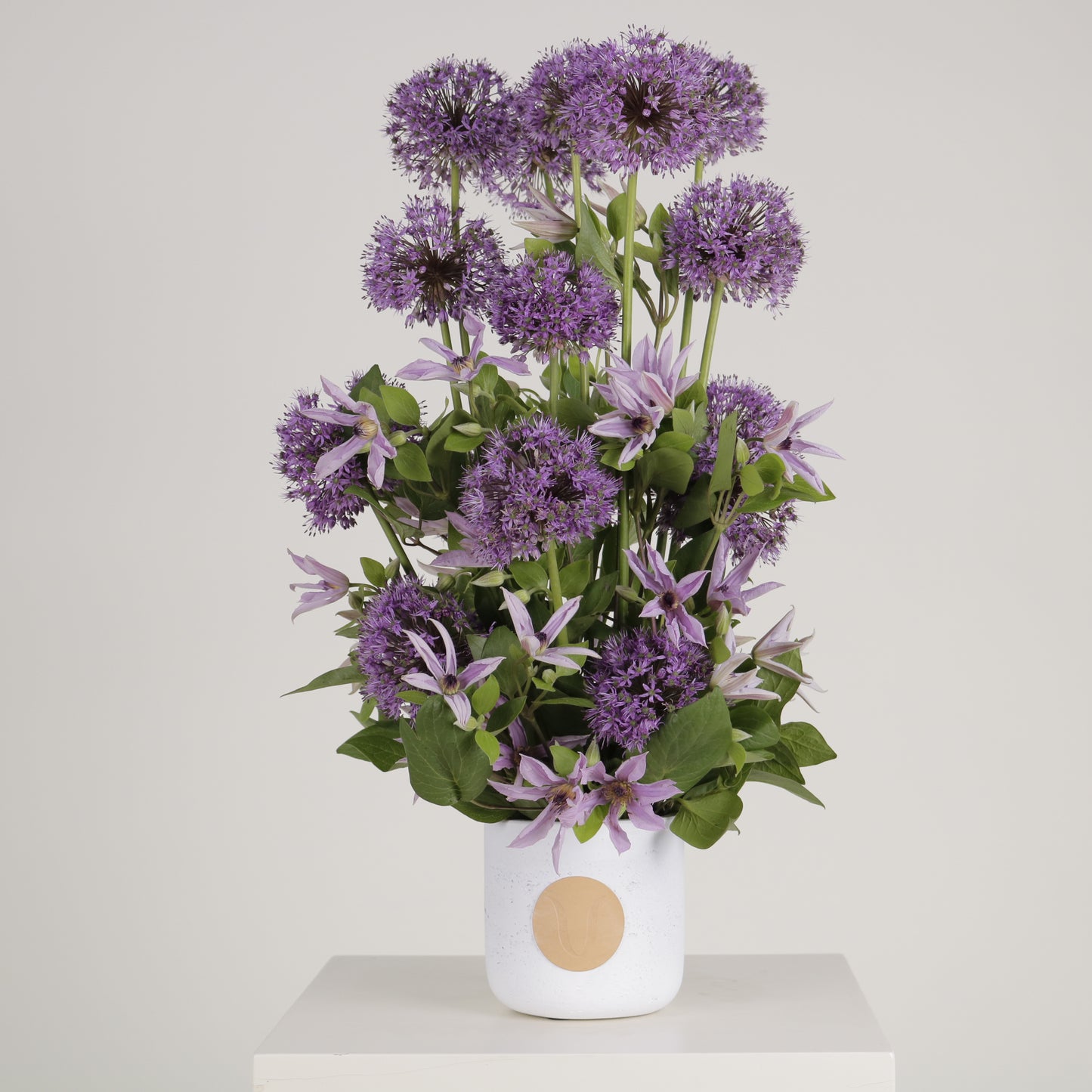Viola luxury floral arrangement purple allium spheres clematis blooms Kuwait Vitali Concept