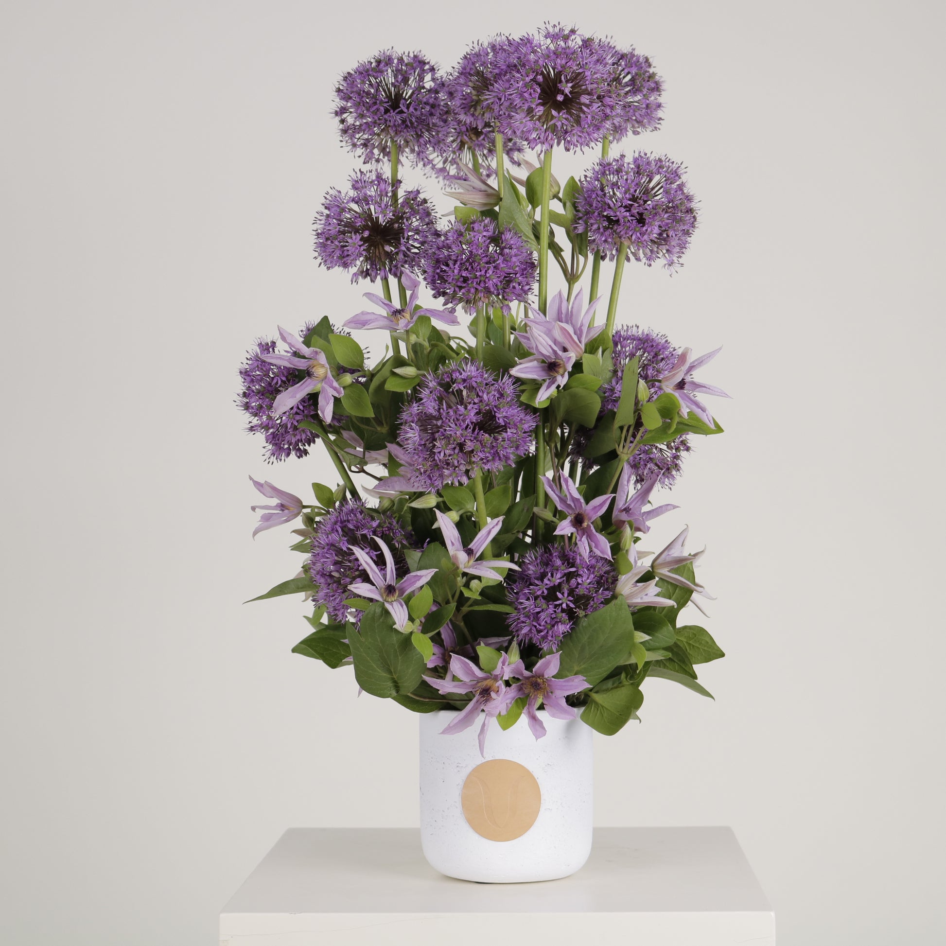 Viola luxury floral arrangement purple allium spheres clematis blooms Kuwait Vitali Concept