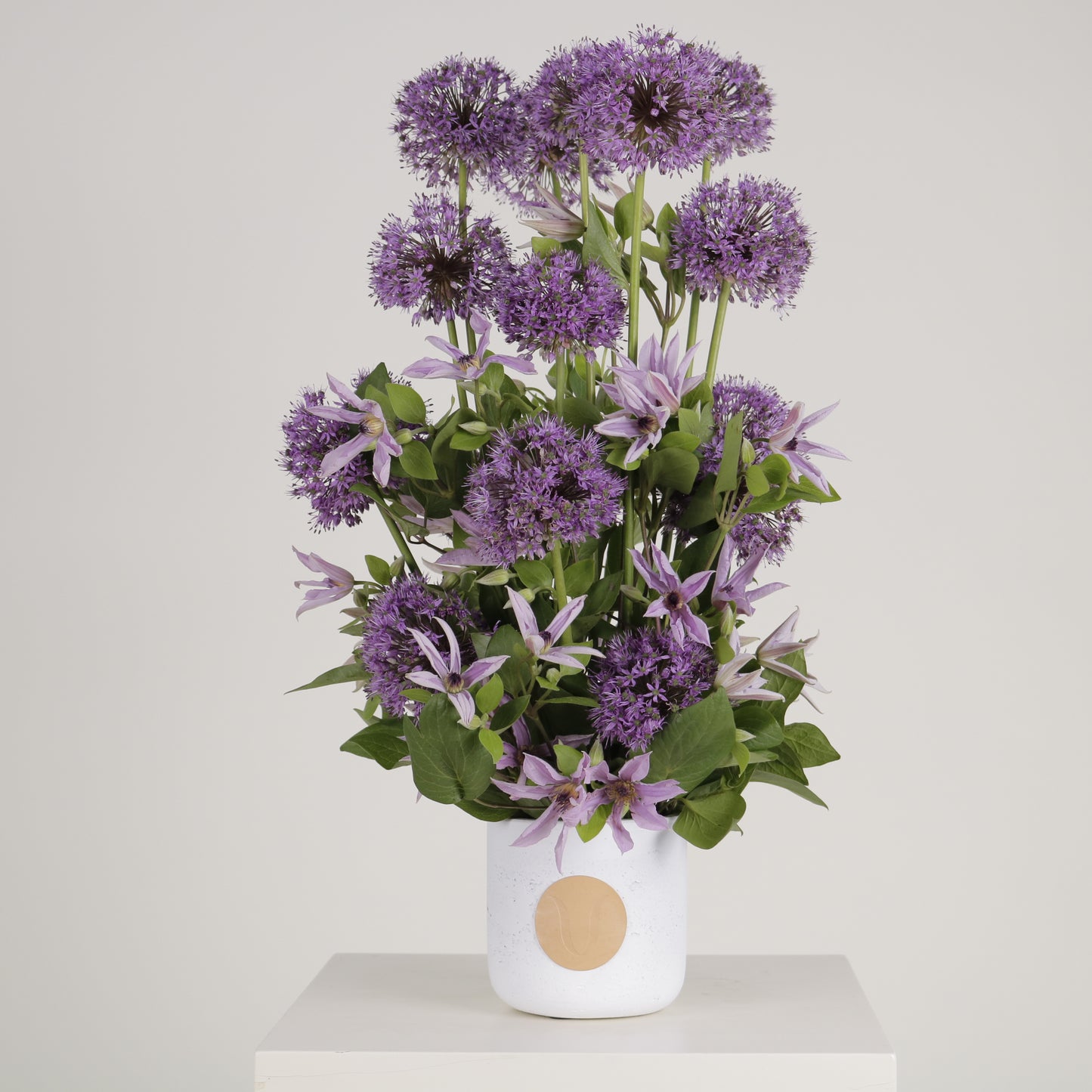 Viola luxury floral arrangement purple allium spheres clematis blooms Kuwait Vitali Concept