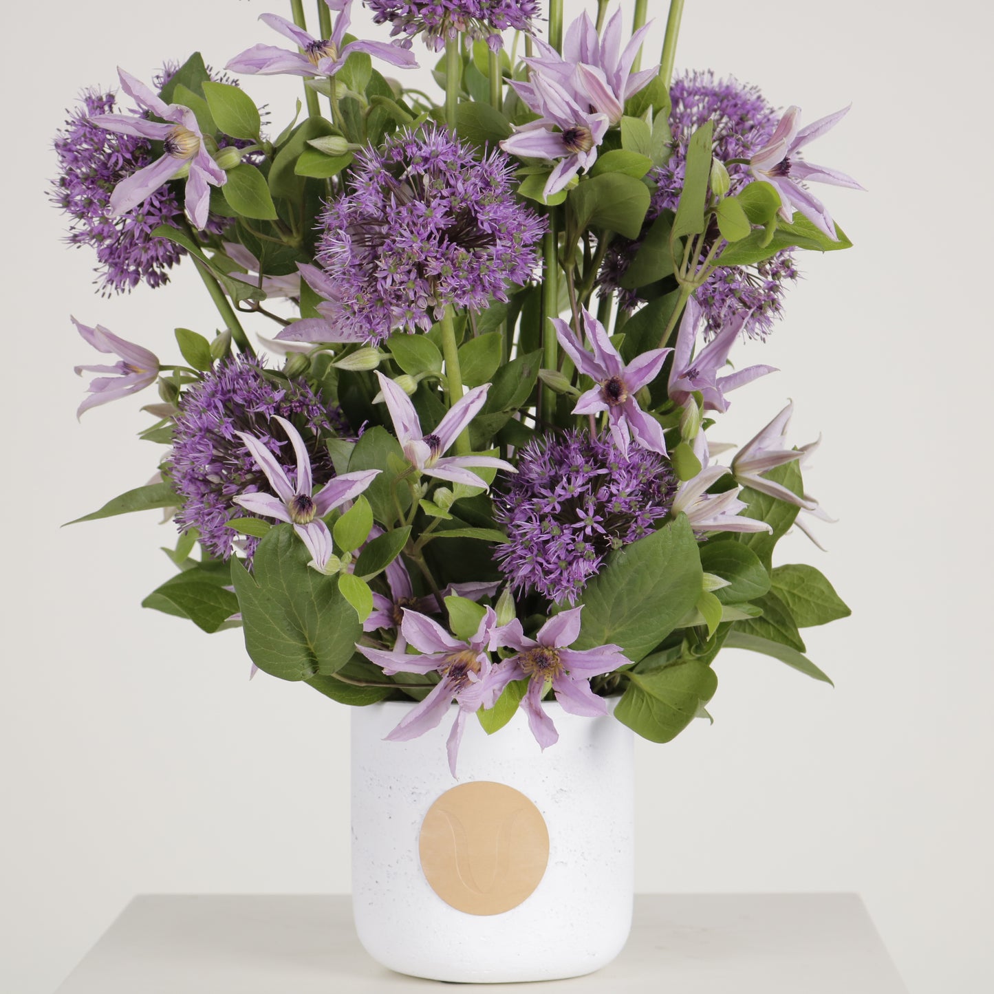 Viola luxury floral arrangement purple allium spheres clematis blooms Kuwait Vitali Concept