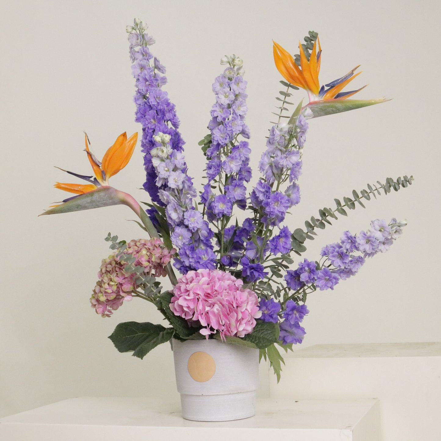 Paradis luxury tropical floral arrangement bird of paradise purple delphinium pink hydrangeas Kuwait Vitali Concept