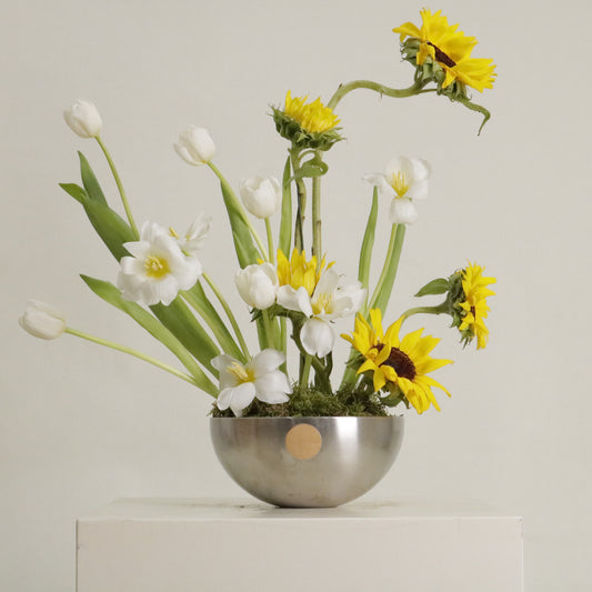Sol luxury floral arrangement sculptural sunflowers white tulips silver bowl Kuwait Vitali Concept