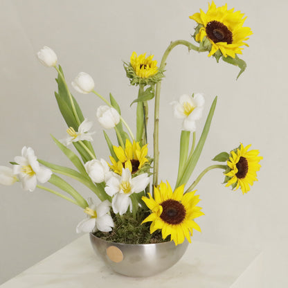 Sol luxury floral arrangement sculptural sunflowers white tulips silver bowl Kuwait Vitali Concept