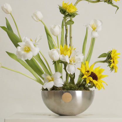 Sol luxury floral arrangement sculptural sunflowers white tulips silver bowl Kuwait Vitali Concept