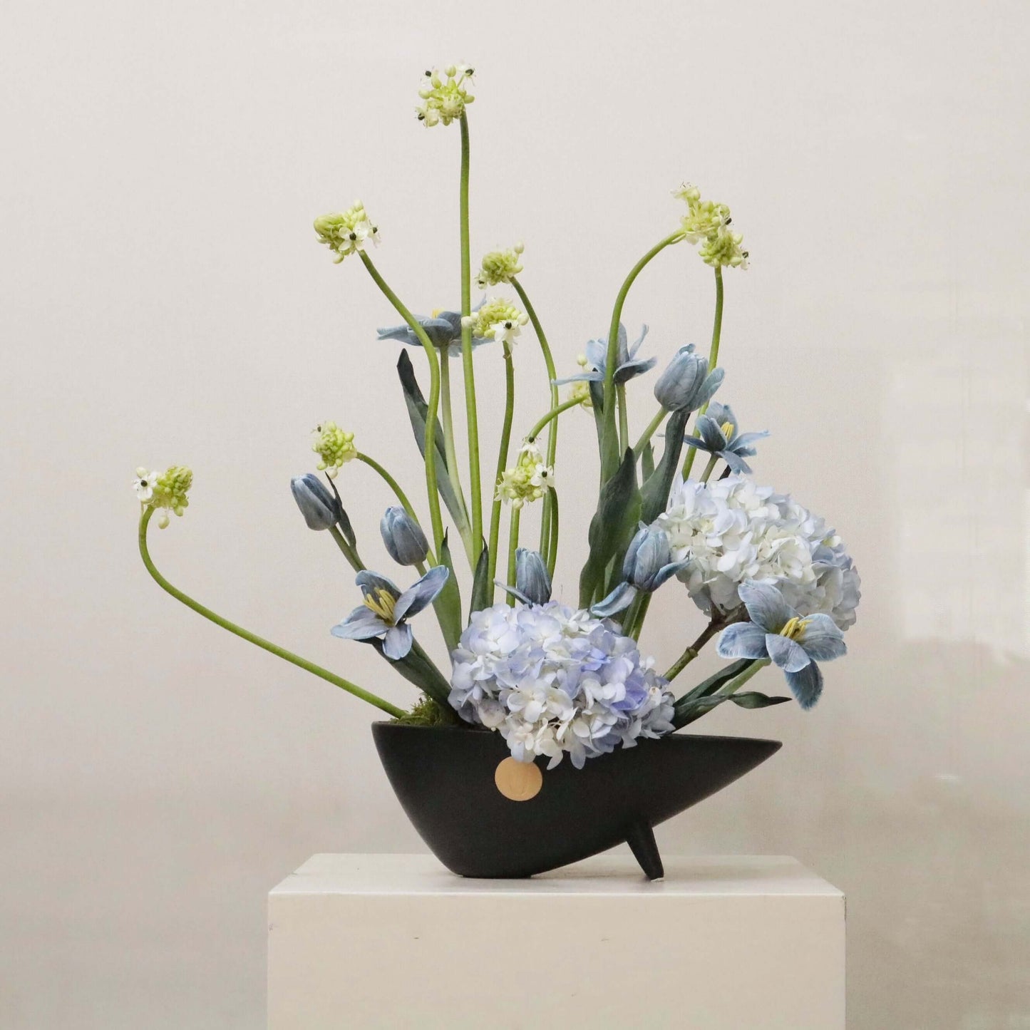 Ver III floral arrangement with hand-painted tulips, blue hydrangeas, and Ornithogalum, inspired by modern artistic expression.