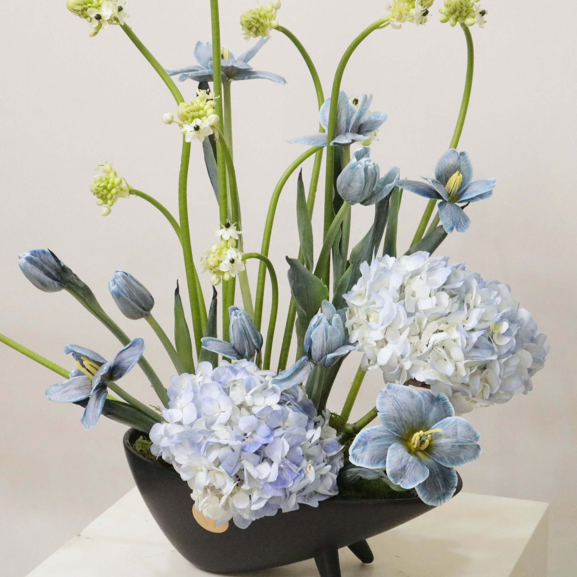 Ver III floral arrangement with hand-painted tulips, blue hydrangeas, and Ornithogalum, showcasing artistic modern elegance.