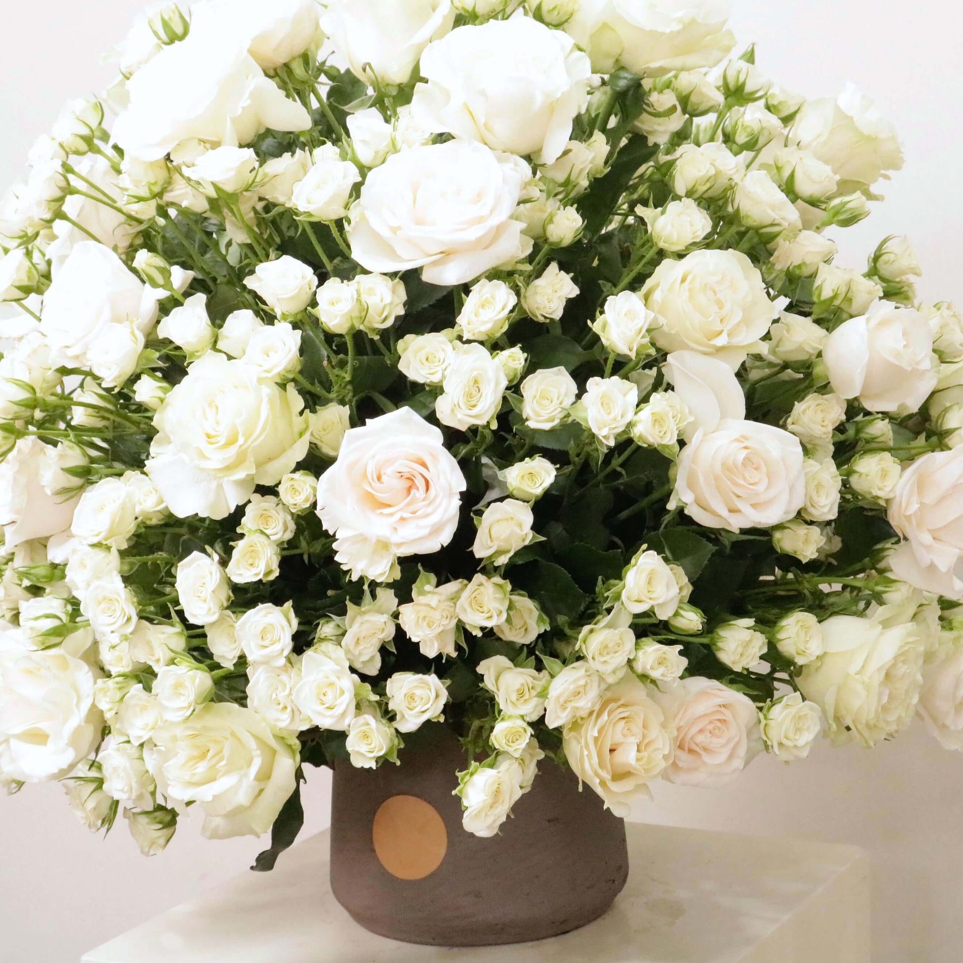 Luxurious Gardenia IV floral arrangement with elegant white and pink roses in a Victorian-inspired bouquet for timeless beauty.