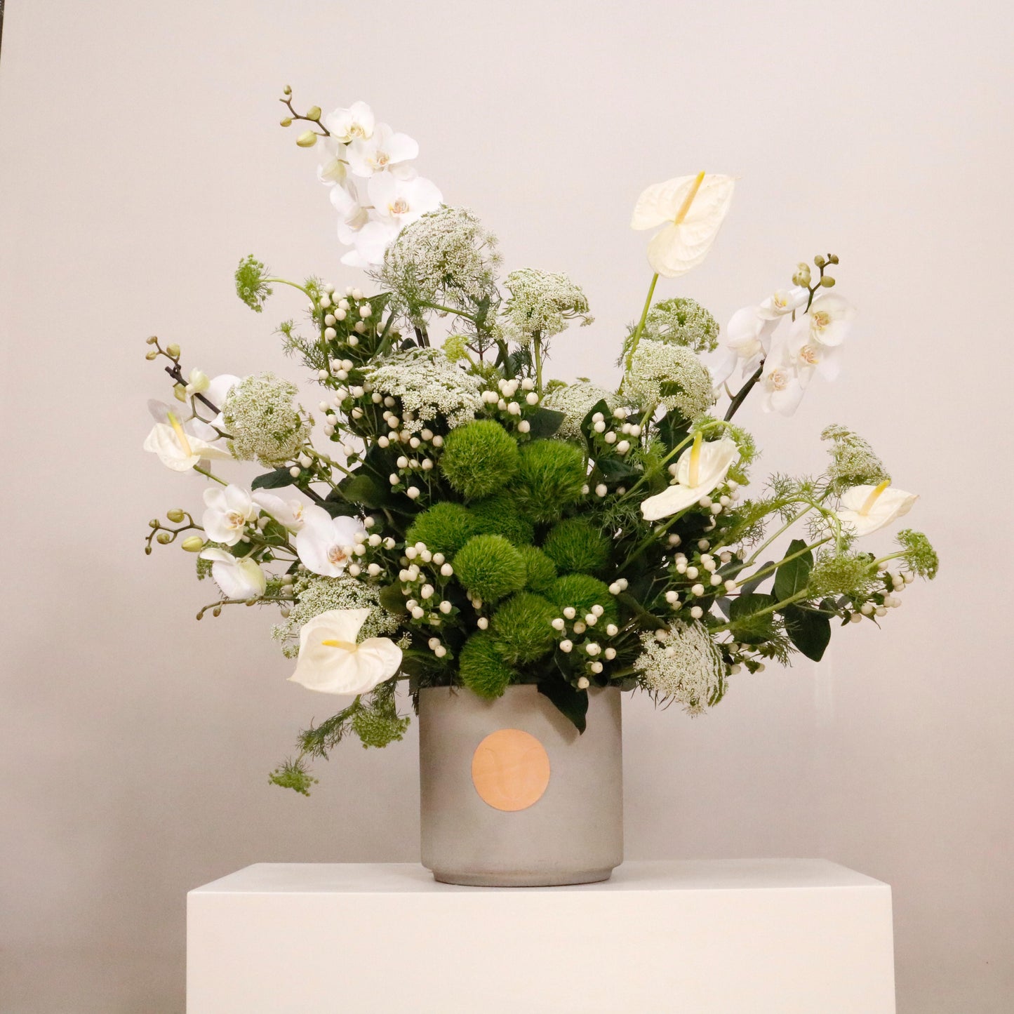 Elegant green and white flower arrangement in a decorative vase, featuring a mix of green flowers and white flowers, 110 CM height, 90 CM width.