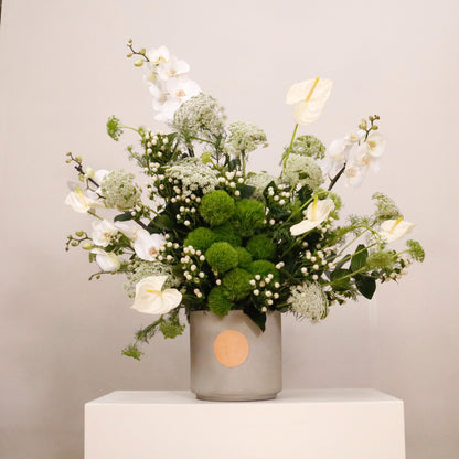 Elegant green and white flower arrangement in a decorative vase, featuring a mix of green flowers and white flowers, 110 CM height, 90 CM width.