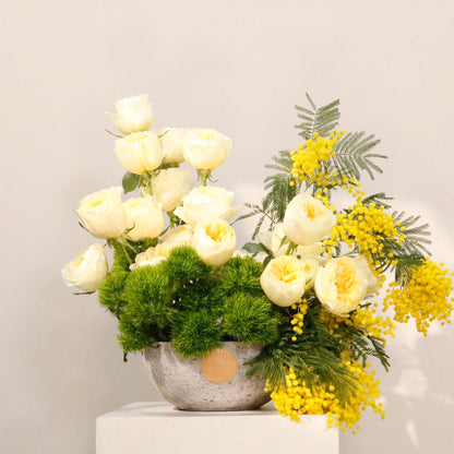 Perfect luxury gift idea. Shop Vitali Concept. Stunning stone vase arrangement with yellow flowers.