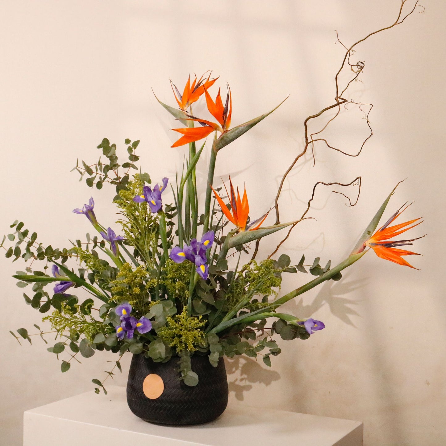 Bird of Paradise Gallery luxury floral arrangement exotic Strelitzia regal Iris matte black vessel Kuwait Vitali Concept