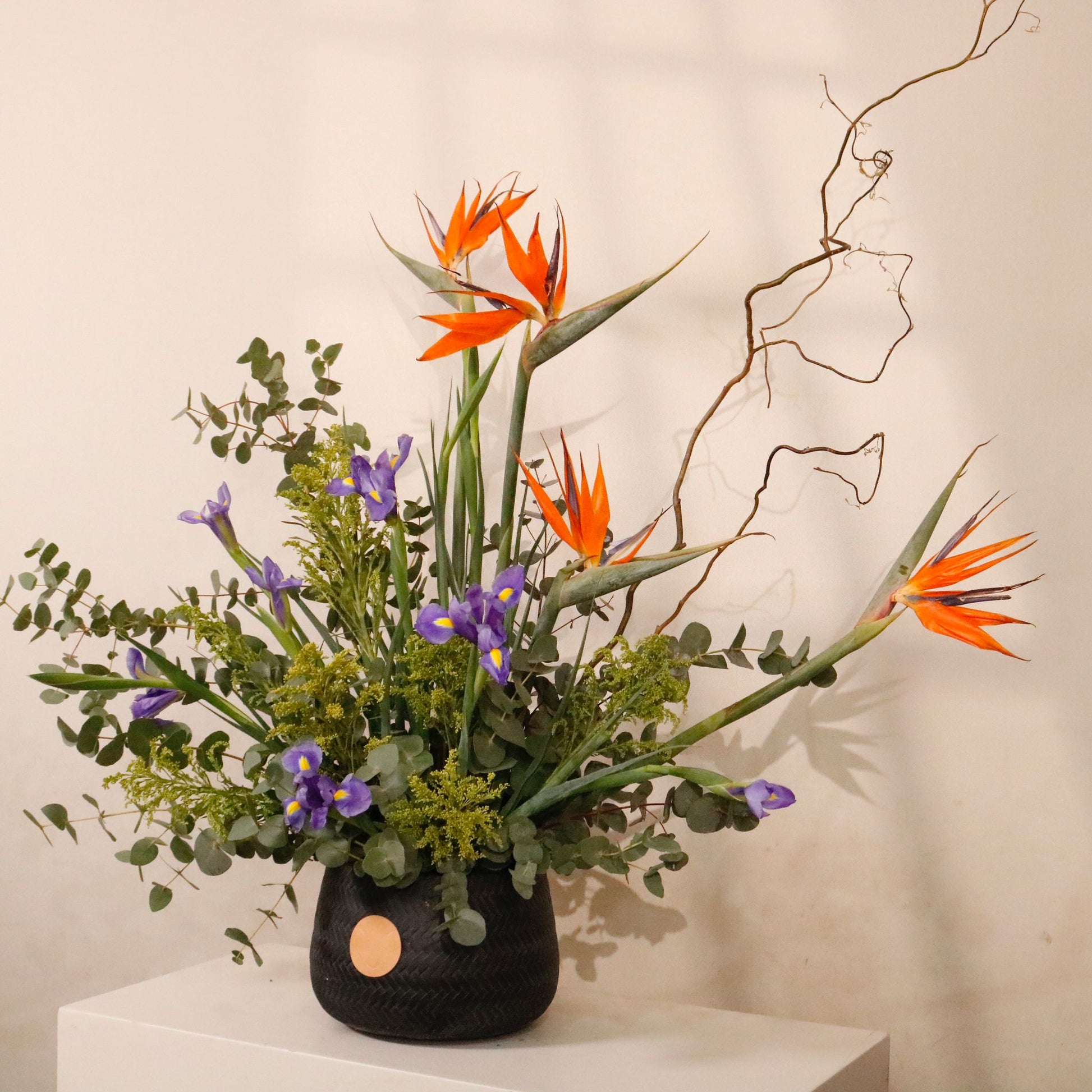 Bird of Paradise Gallery luxury floral arrangement exotic Strelitzia regal Iris matte black vessel Kuwait Vitali Concept
