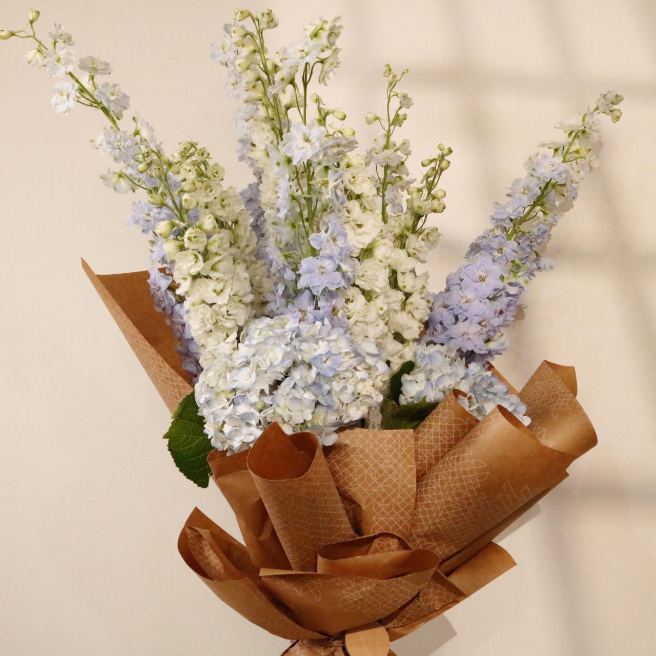 Azure Sky Bouquet luxury floral arrangement blue hydrangeas white orchids premium handcrafted gifting Kuwait Vitali Concep