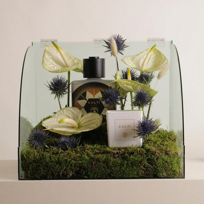 Luxury car accessory display with flowers showcasing a Lamborghini car diffuser set for a sophisticated scent experience.