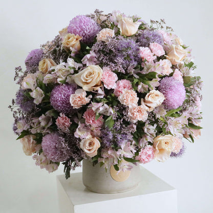 Victorian-inspired floral arrangement with pink, purple, and cream blooms in a classic display, 90 cm tall, creating timeless beauty.