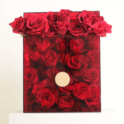 Luxurious box with Royal Roses, perfect for anniversaries and romantic gifts. Elegant red roses arranged beautifully inside the box.